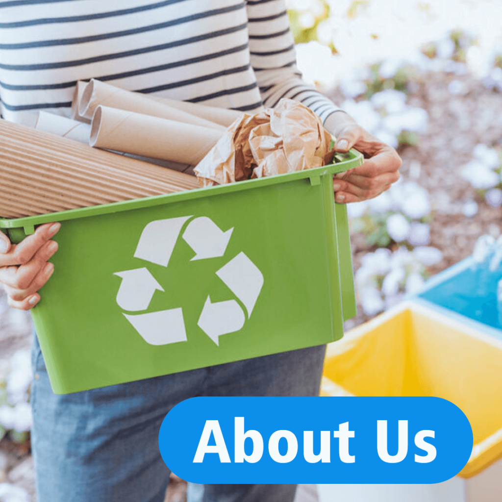 A woman holds a recycle bin full of cardboard recyclables with a blue round tag that reads "About Us".