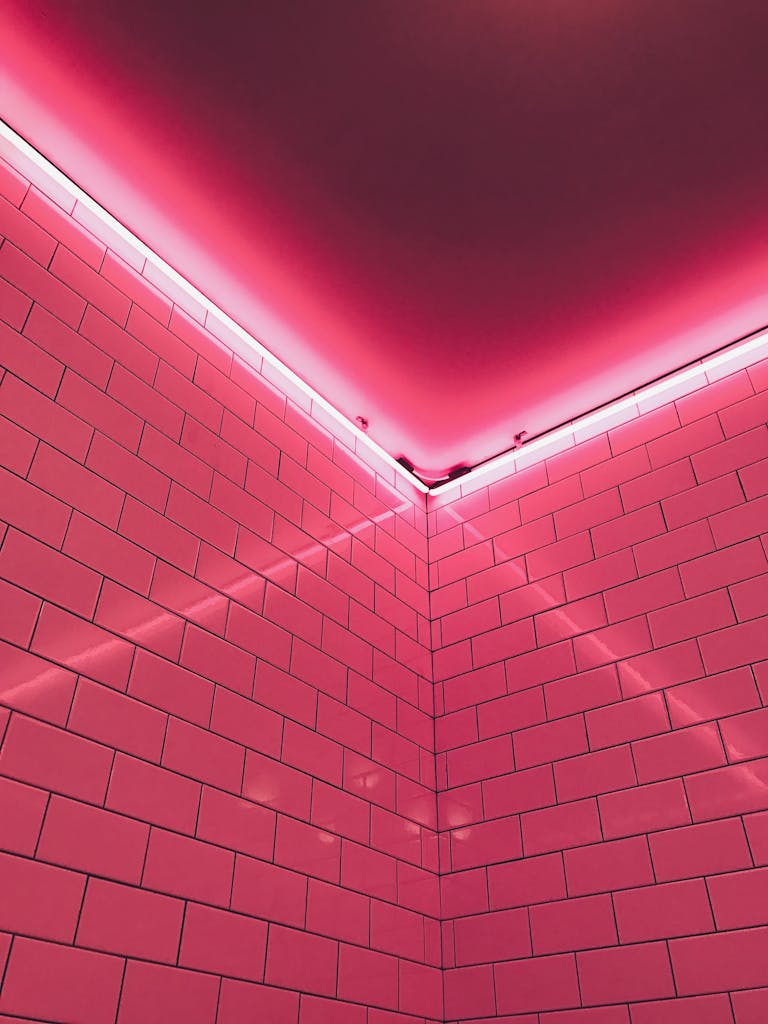 Aesthetic neon-lit pink tiled corner creating a vibrant digital marketing atmosphere.