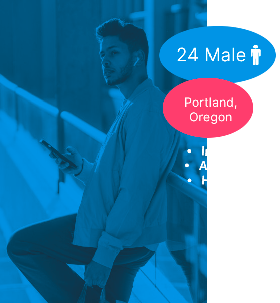 Young man in city, leaning with smartphone and eco-friendly bag, enjoying outdoor lifestyle.
