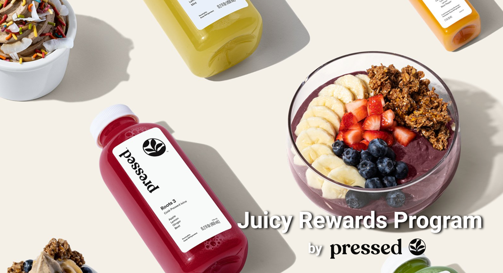 Juicy Rewards presentation cover slide with bottles of colorful Pressed Juicery smoothies and a bowl of mixed fruit on a beige background. 