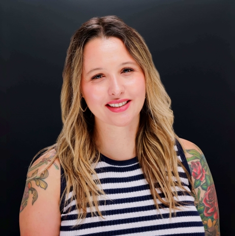 A professional headshot of Vivid Dm's digital marketing analyst and chief strategist, Camy Griesel.